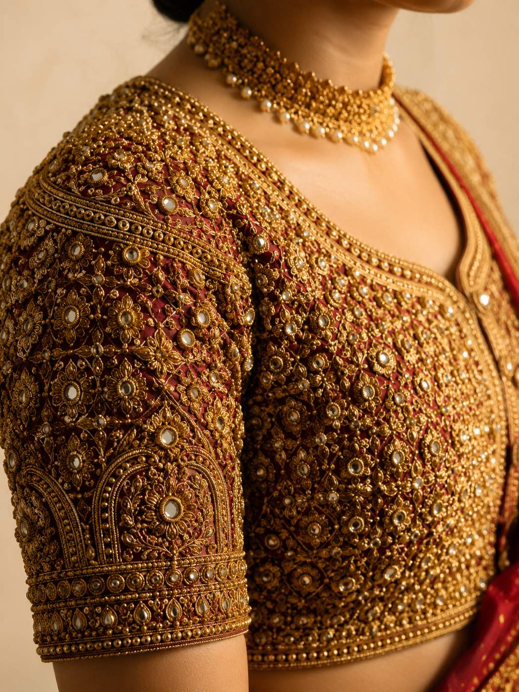 Bridal blouse worked edge to edge in dense antique-gold zardozi and kundan